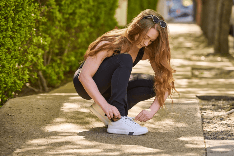 woman choosing the best sneakers for plantar fasciitis