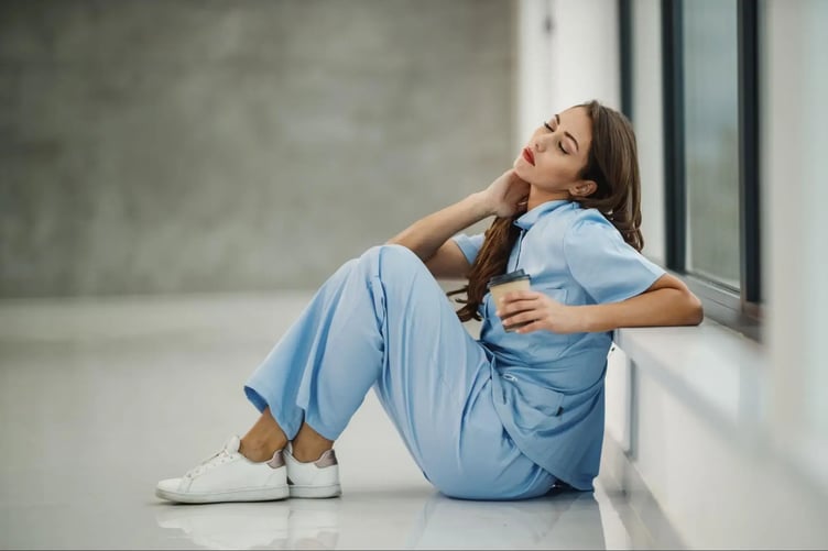 woman thinking of top rated nursing shoes